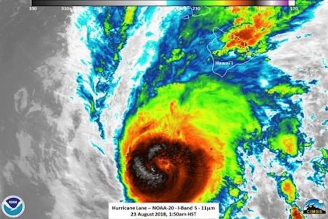 This satellite image provided by NOAA shows Hurricane Lane near Hawaii on Thursday, Aug. 23, 2018. Hurricane Lane soaked Hawaii’s Big Island on Thursday, and the The National Weather Service warned that some areas could see up to 30 inches before the system passes. (NOAA via AP)