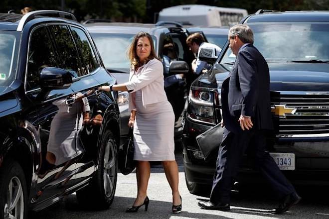 Canada’s Foreign Affairs Minister Chrystia Freeland, left, walks to a car during a break in trade talk negotiations from the Office of the United States Trade Representative, Thursday, Aug. 30, 2018, in Washington. (AP Photo/Jacquelyn Martin)