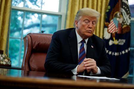 U.S. President Donald Trump talks on the phone with Mexican President Enrique Pena Nieto, in the Oval Office of the White House in Washington on Aug. 27, 2018. (AP Photo/Evan Vucci)