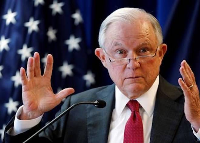 In this July 13, 2018 photo, Attorney General Jeff Sessions delivers remarks in Portland, Maine. President Donald Trump is escalating his attacks on Attorney General Jeff Sessions, suggesting the embattled official should have intervened in investigations of two GOP congressmen to help Republicans in the midterms. AP Photo/Robert F. Bukaty)