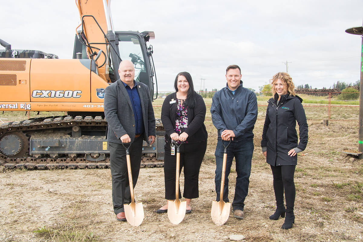 Lacombe Mayor Grant Creasey, AHS area manager for Lacombe and Bentley Kimberley Sommerville, Site Manager Dale MacDonald and Tricon Developments Project Director Jessica Pell broke ground on a new Lacombe Community Health Centre which is slated to open in 12 to 18 months.                                Todd Colin Vaughan/Lacombe Express
