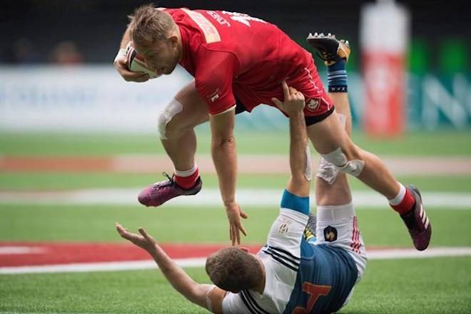 Canada’s Harry Jones, top, collides with France’s Thibauld Mazzoleni while running with the ball during World Rugby Sevens Series action, in Vancouver, B.C., on Sunday March 11, 2018. THE CANADIAN PRESS/Jonathan Hayward