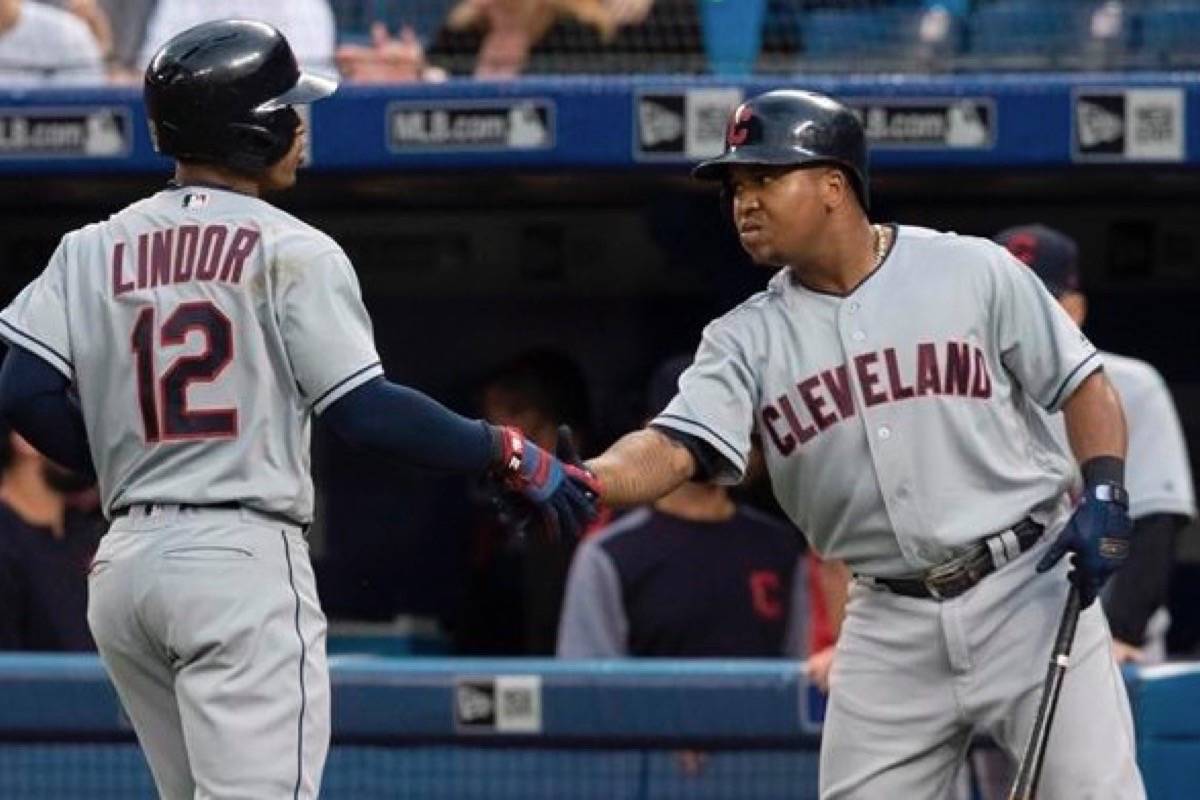 Cleveland Indians’ Francisco Lindor celebrates with teammate Jose Ramirez after he hit a lead off home run against the Toronto Blue Jays in the first inning of their American League MLB baseball game in Toronto on Thursday September 6, 2018. (THE CANADIAN PRESS/Fred Thornhill)