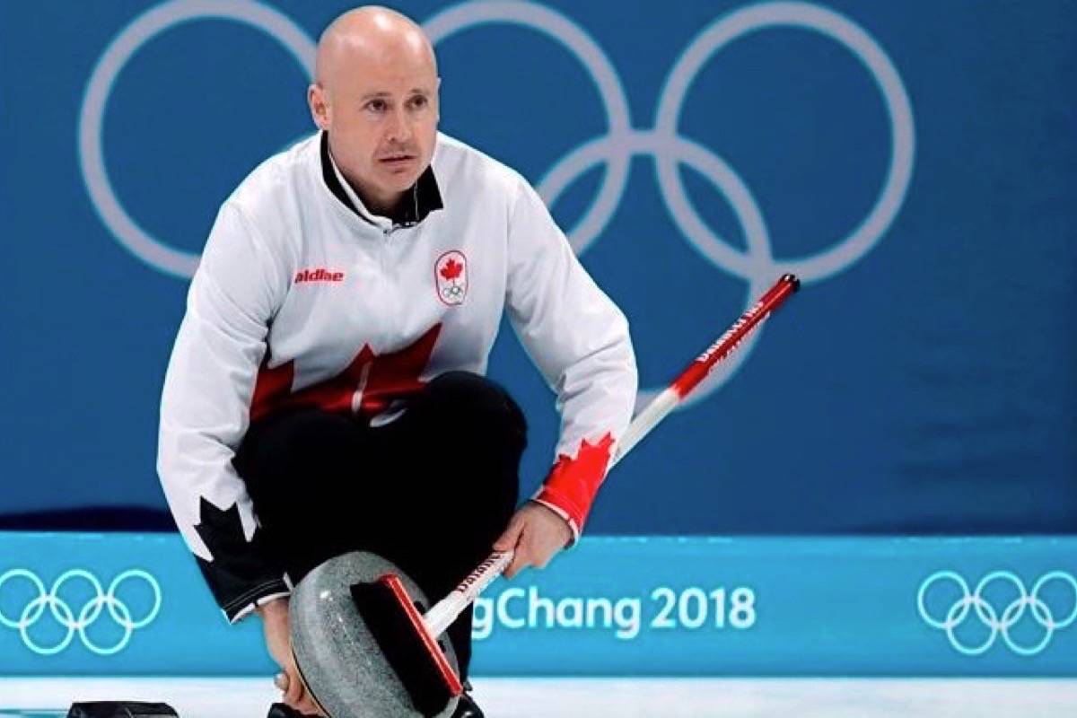 Canada’s skip Kevin Koe uses his broom to clean the stone during the men’s curling match against Switzerland at the 2018 Winter Olympics in Gangneung, South Korea on Feb. 23, 2018. (THE CANADIAN PRESS/AP, Aaron Favila)