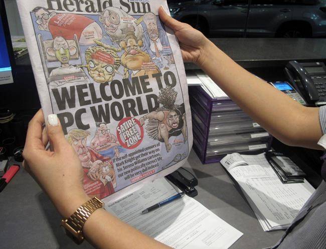 Melbourne-based newspaper Herald Sun displays a controversial cartoon of Serena Williams that has been widely condemned as a racist depiction of the tennis great, in Melbourne, Australia, Wednesday, Sept. 12, 2018. (AP Photo)