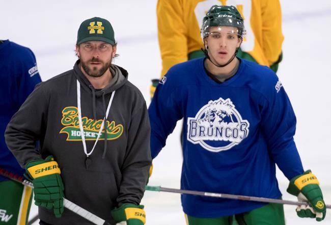 Humboldt Broncos returning player Brayden Camrud and head coach Nathan Oystrick are seen during a team practice Tuesday, Sept. 11, 2018. (THE CANADIAN PRESS/Jonathan Hayward)