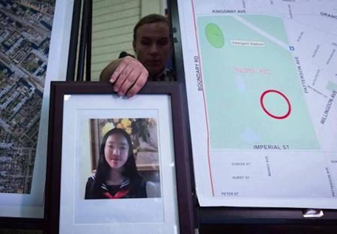 RCMP Cpl. Daniela Panesar places a photo of Marrisa Shen, 13, next to a map indicating where her body was found in Central Park, during a news conference in Burnaby, B.C., on Wednesday, July 19, 2017. THE CANADIAN PRESS/Darryl Dyck