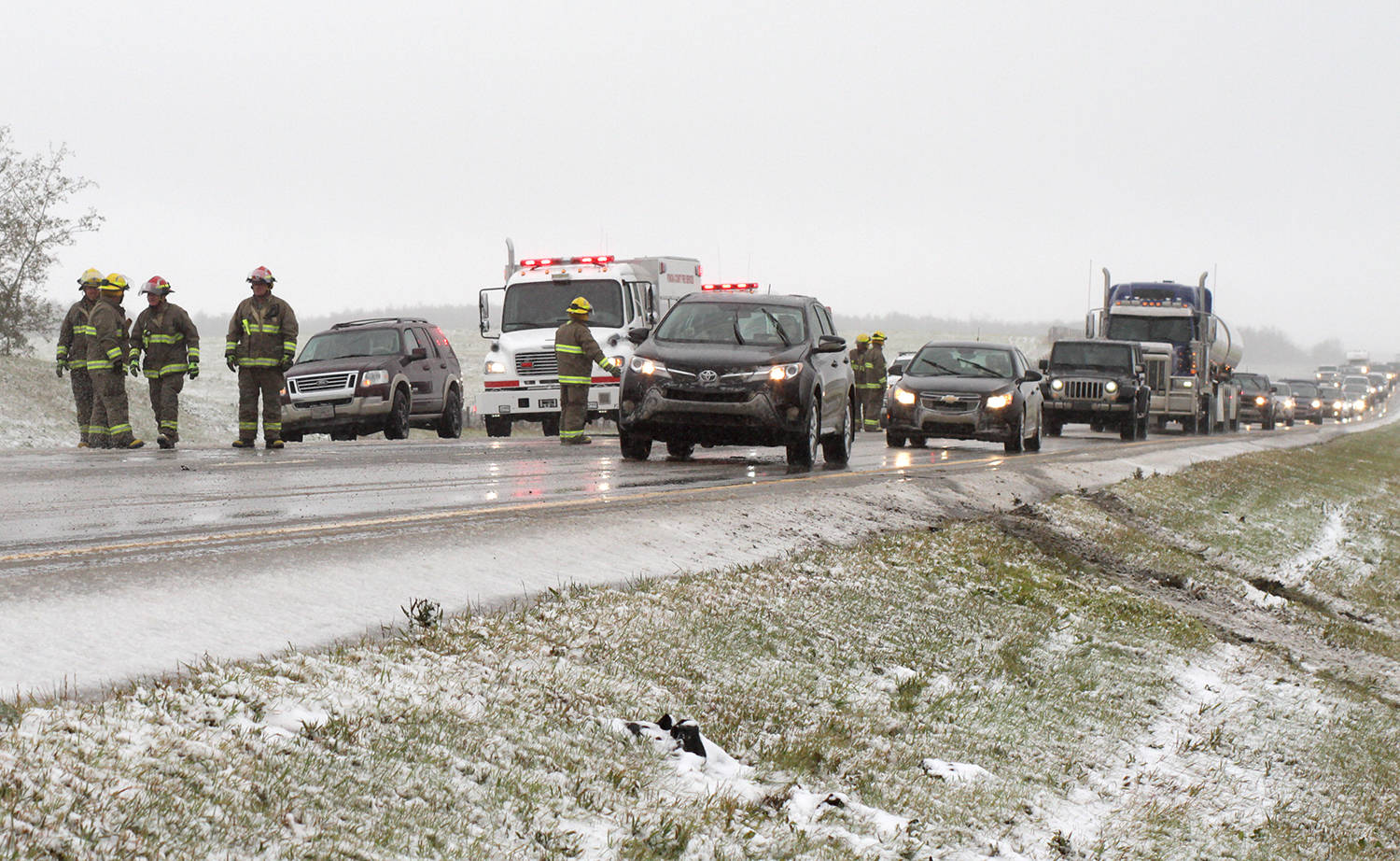 Southbound lanes on Highway 2 were slow-going for some time while crews cleared the scene.                                Photo by Jeffrey Heyden-Kaye