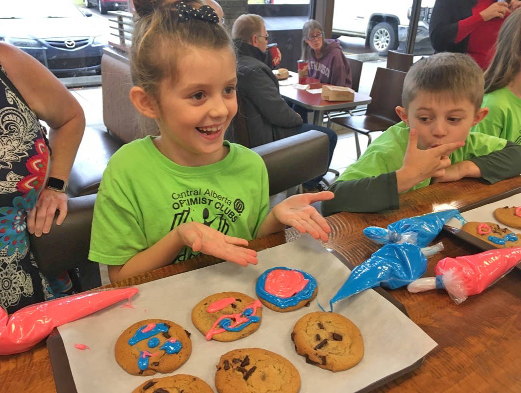 Jersey Blair and Mayson Thompson enjoy decorating Smile Cookie at Tim Horton’s on Sept. 18th for the Smile Cookie campaign. Mark Weber/Red Deer Express