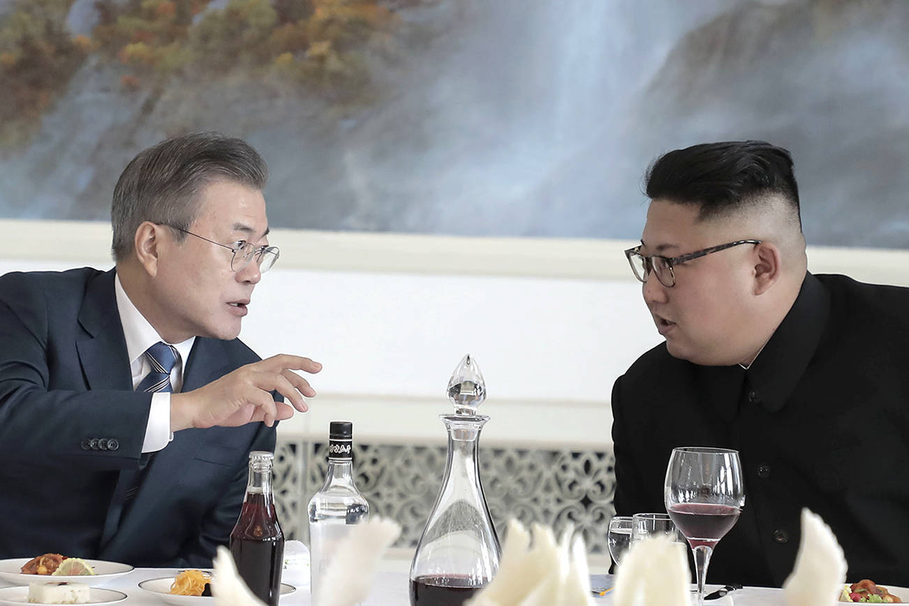 South Korean President Moon Jae-in, left, and North Korean leader Kim Jong Un shakes hands after signing the documents at the Paekhwawon State Guesthouse in Pyongyang, North Korea, Wednesday, Sept. 19, 2018. (Pyongyang Press Corps Pool via AP)