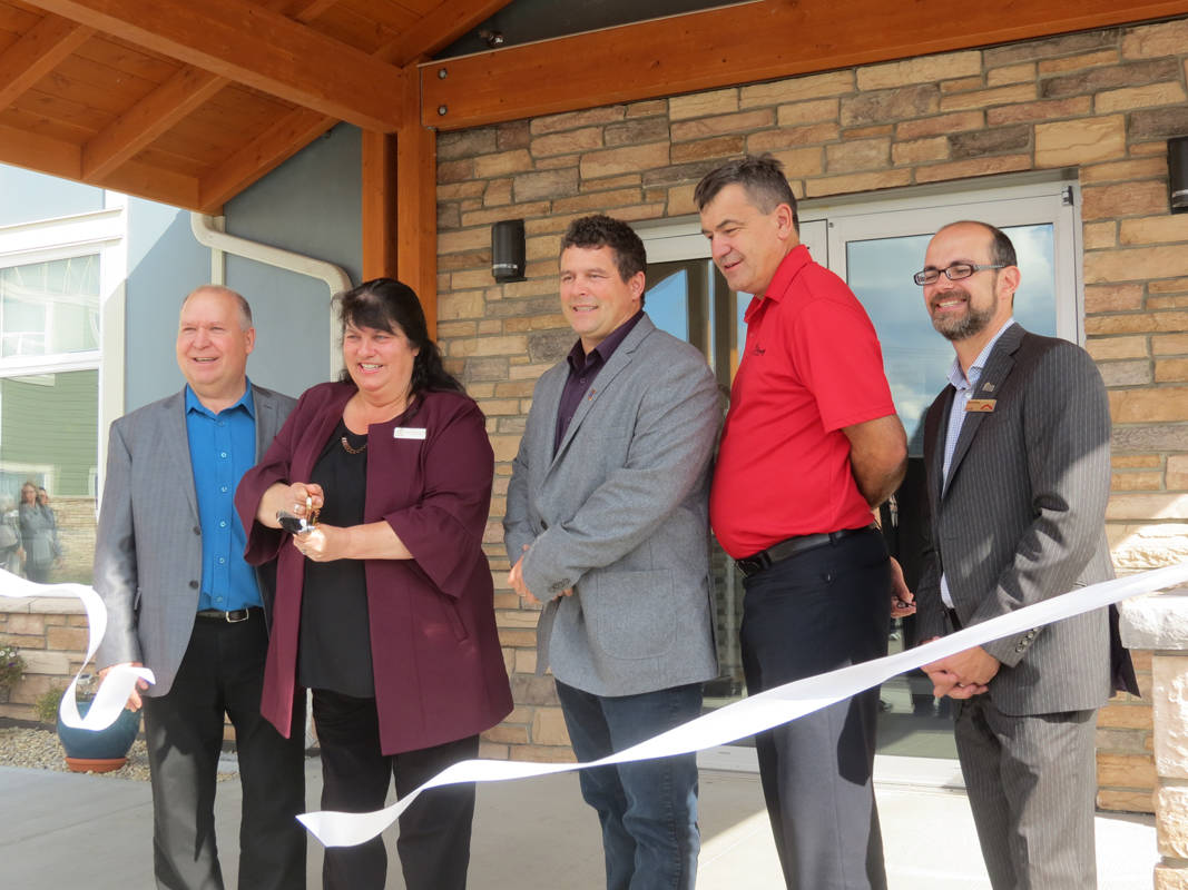 The official opening of Valley View Manor was held today with close to 150 people including residents in attendance. Pictured in the ribbon cutting are Rimbey Mayor Rick Pankiw, MLA for Red Deer North, Karen Schreiner, Rimoka Housing Foundation board chairman, Paul McLaughlin, chief administrative officer Peter Hall and Canada Mortgage and Housing Corporation affordable housing consultant, Dany Skelling. Treena Mielke Photo