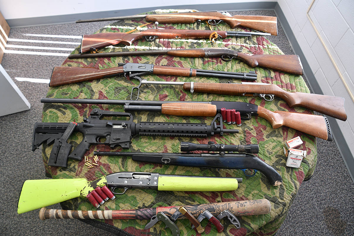 Ponoka RCMP display the nine firearms seized after two men were arrested after an early morning chase on Sept. 18. At least seven of the weapons are believed to be stolen. Image: RCMP