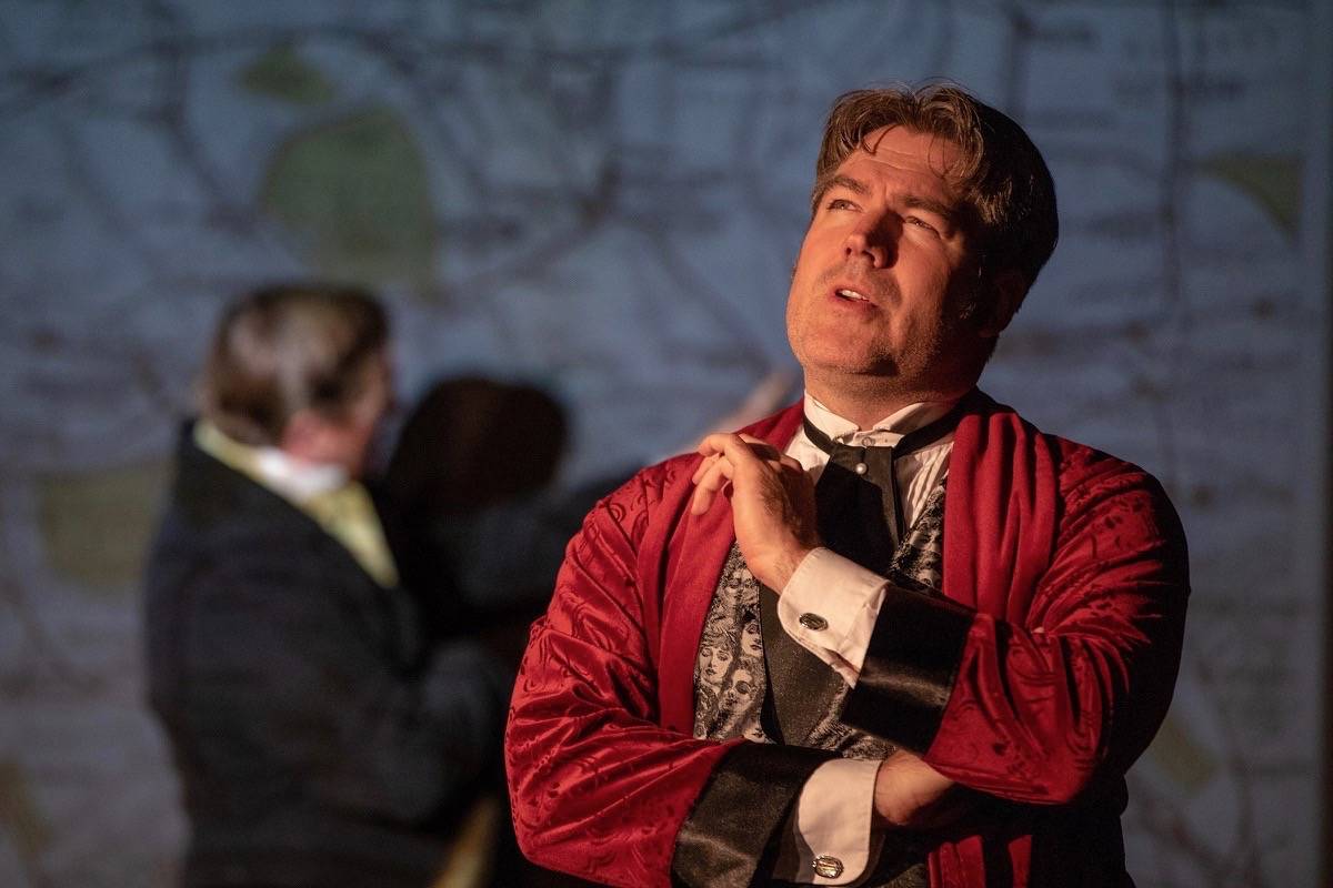 Sherlock Holmes (Jason Steele) ponders his latest case with his brother Mycroft Holmes (Matthew Taylor) in the background during a scene from The Second Stain, currently playing at the Nickle Studio.                                David Dinan photo