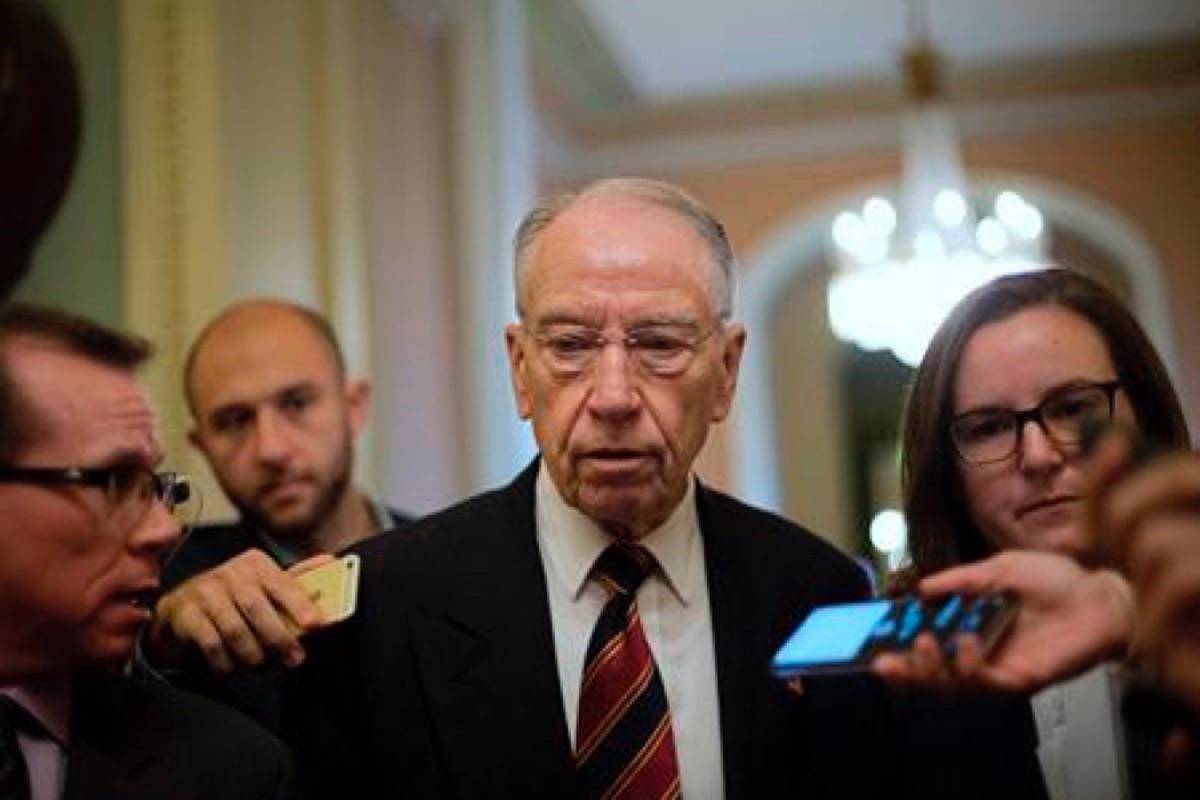 Sen. Chuck Grassley, R-Iowa, walks past members of the media as he heads to the Senate Chamber floor on Capitol Hill in Washington, Tuesday, Sept. 18, 2018. (AP Photo/Pablo Martinez Monsivais)