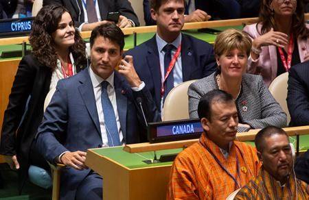 Prime Minister Justin Trudeau and International Development Minister Marie-Claude Bibeau listen to speakers at the Nelson Mandela Peace Summit opening ceremony at the United Nations Headquarters, Monday, Sept. 24, 2018. (THE CANADIAN PRESS/Adrian Wyld)