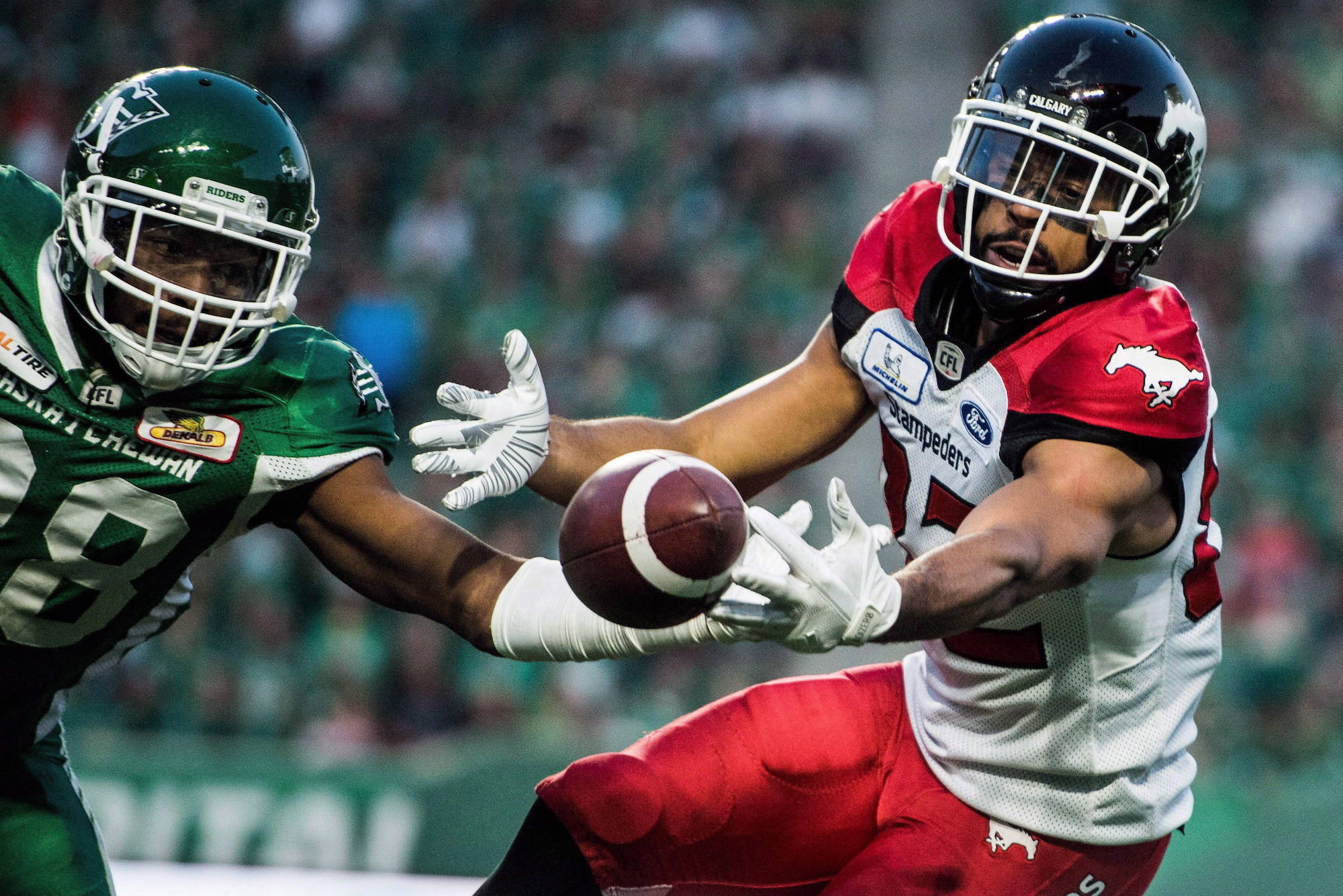 Calgary Stampeders wide receiver Juwan Brescacin (82) reaches for a pass during second half CFL action against the Saskatchewan Roughriders, in Regina on Sunday, August 19, 2018. THE CANADIAN PRESS/Matt Smith