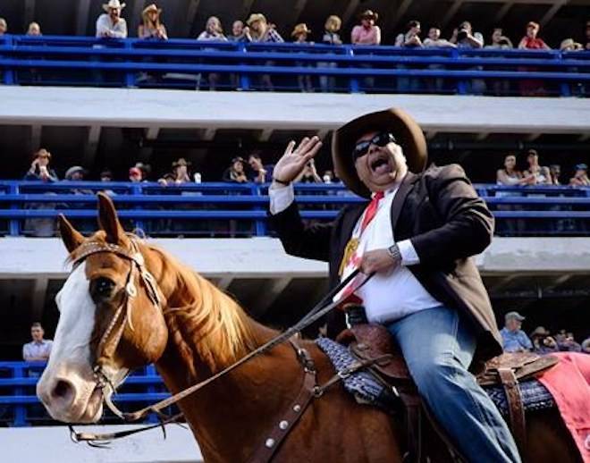 Calgary Mayor Naheed Nenshi rides a horse during the Calgary Stampede parade in Calgary, Friday, July 7, 2017. THE CANADIAN PRESS/Jeff McIntosh