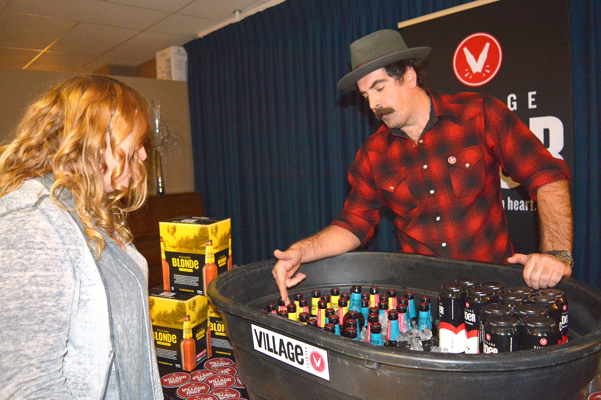 Mike Garth from Village Brewery in Calgary attends the Taste of Stettler for the first time at the Hub Sept. 21. He said he came to raise awareness about Village Brewery’s beers, ciders and seasonal drinks. (Lisa Joy/Stettler Independent)