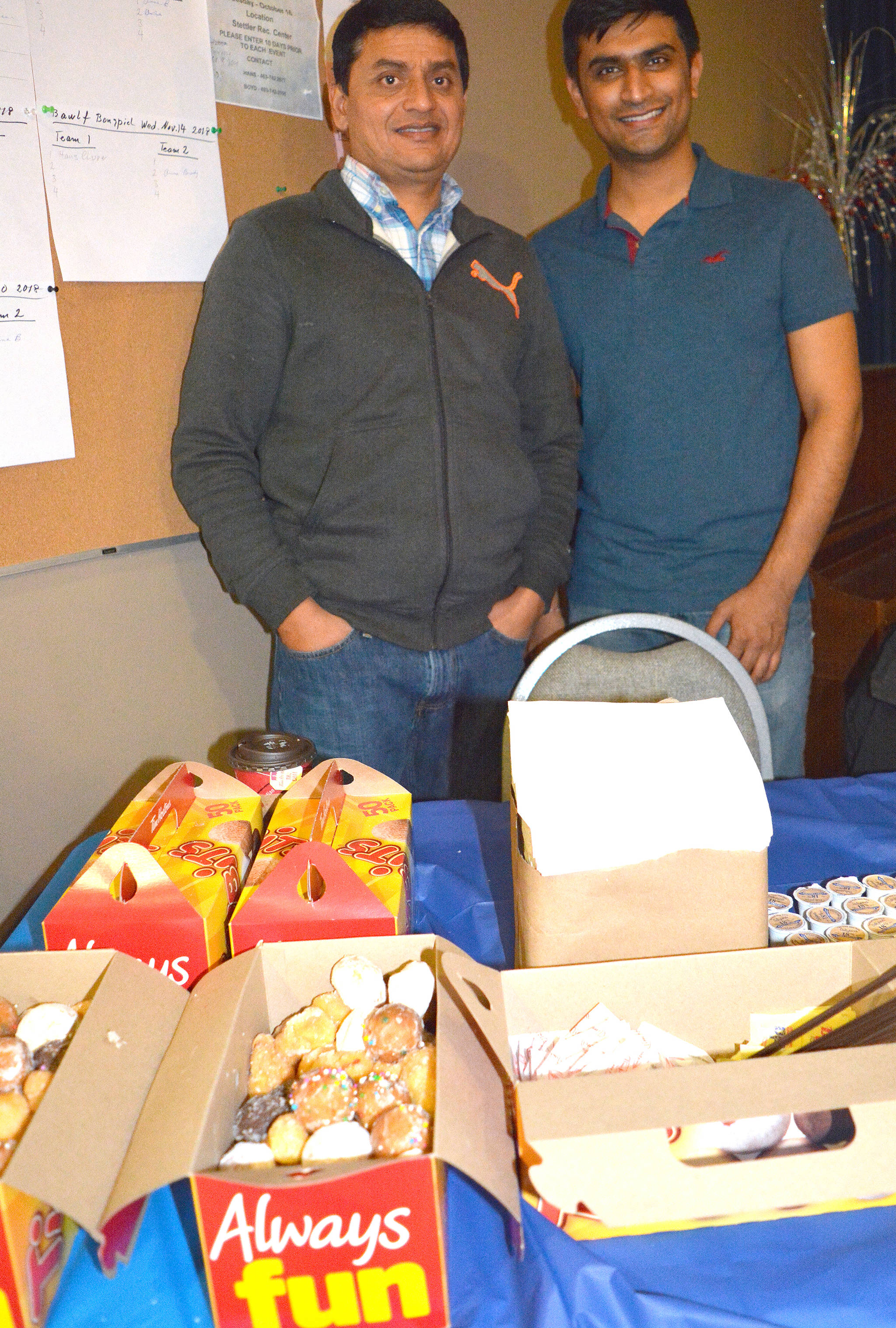 Ritesh Patel, left, and Dhouv Patel from Stettler’s Tim Hortons had hot coffee, Tim bits and other treats for participants of Taste of Stettler at the Hub on Sept. 21.                                Lisa Joy/Stettler Independent