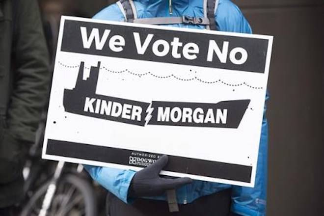 First Nations and anti-pipeline groups rally outside the TD bank in downtown Vancouver, Friday, March 10, 2017. Federal lawyers want closed-door hearings in a high-profile court case about allegations of Canadian Security Intelligence Service spying on anti-pipeline activists. THE CANADIAN PRESS/Jonathan Hayward