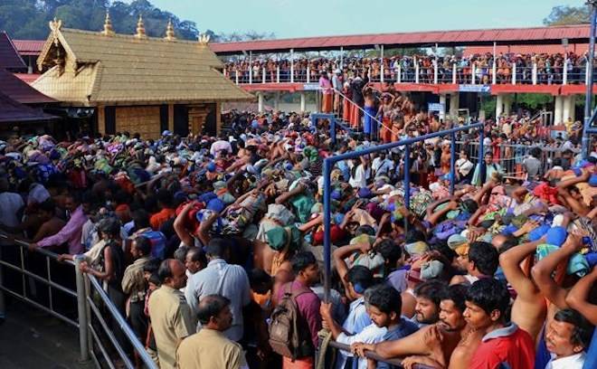 In this Dec. 1, 2015 file photo, Hindu worshippers queue during a pilgrimage at the Sabarimala temple in the southern Indian state of Kerala. (AP Photo/ Hareesh Kumar A S, File)