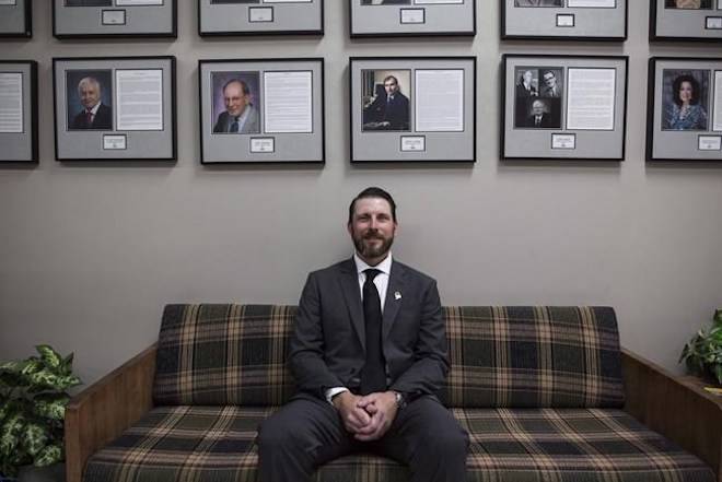 New Humboldt Broncos coach and General Manger Nathan Oystrick sits for a portrait inside the Elgar Petersen Arena in Humboldt, Sask., Tuesday, July, 3, 2018.Kayle Neis / THE CANADIAN PRESS