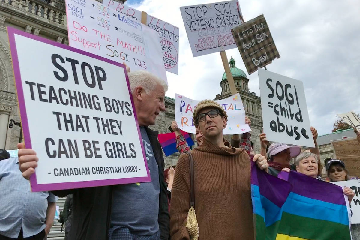 Protesters and counter-protestors share their polarizing views on the contentious SOGI 123 curriculum at the B.C. Legislature Sept.29. (Keri Coles/News Staff)