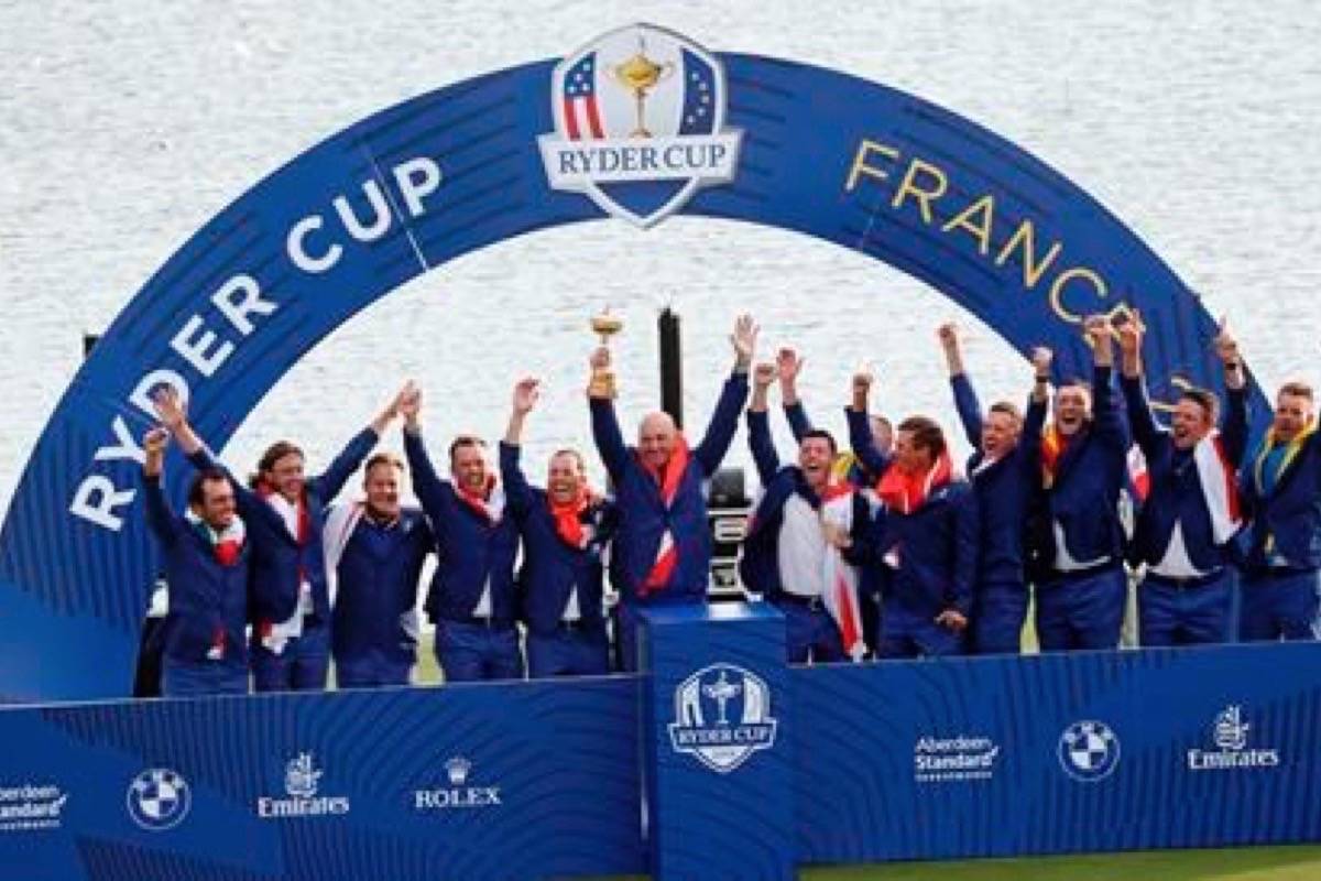 Europe team captain Thomas Bjorn, center, holds the trophy aloft as he celebrates with his team after Europe won the Ryder Cup on the final day of the 42nd Ryder Cup at Le Golf National in Saint-Quentin-en-Yvelines, outside Paris, France, Sunday, Sept. 30, 2018. (Laurent Cipriani/AP)