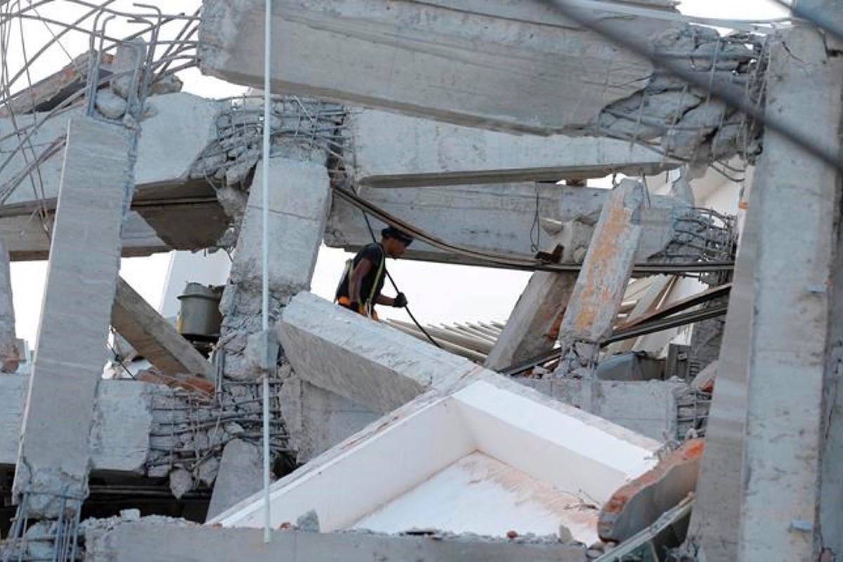 A rescuer shifts through the damaged Roa-Roa Hotel following a massive earthquakes and tsunami in Palu, Central Sulawesi, Indonesia, Sunday, Sept. 30, 2018. Rescue officials feared the full scale of Indonesia’s earthquake and tsunami could climb far past the more than 800 already confirmed dead, as several large coastal towns remained cut off Sunday by damaged roads and downed communication lines. (Tatan Syuflana/AP)