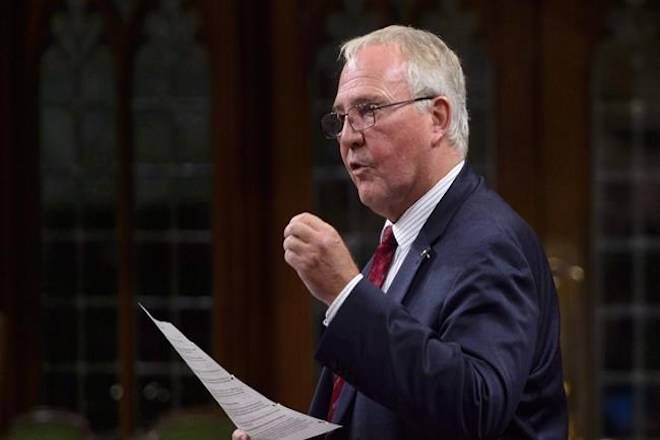 Bill Blair, Minister of Border Security and Organized Crime Reduction, stands during question period in the House of Commons on Parliament Hill in Ottawa on Monday, Sept. 17, 2018. Irregular border crossers being housed temporarily in hotels in Toronto will have their stays extended by four weeks while officials continue to search for a longer-term solution. THE CANADIAN PRESS/Sean Kilpatrick