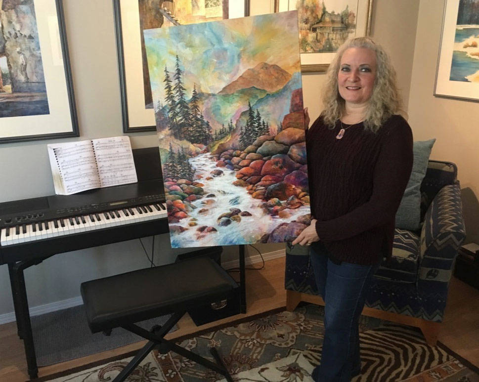 Local artist Marianne Harris, seen here with one of her more recent works, continues to make her creative mark on the community while always moving forward in her own artistic growth.                                Mark Weber/Red Deer Express