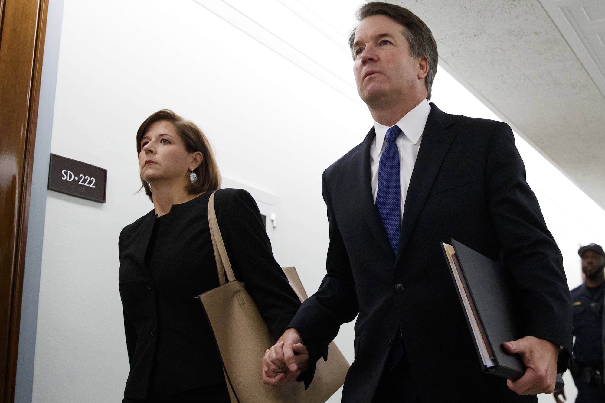 Brett Kavanaugh, President Donald Trump’s Supreme Court nominee, and his wife Ashley Estes Kavanaugh, hold hands as they arrive for a Senate Judiciary Committee hearing on Capitol Hill in Washington, Thursday, Sept. 27, 2018. (AP Photo/Carolyn Kaster)