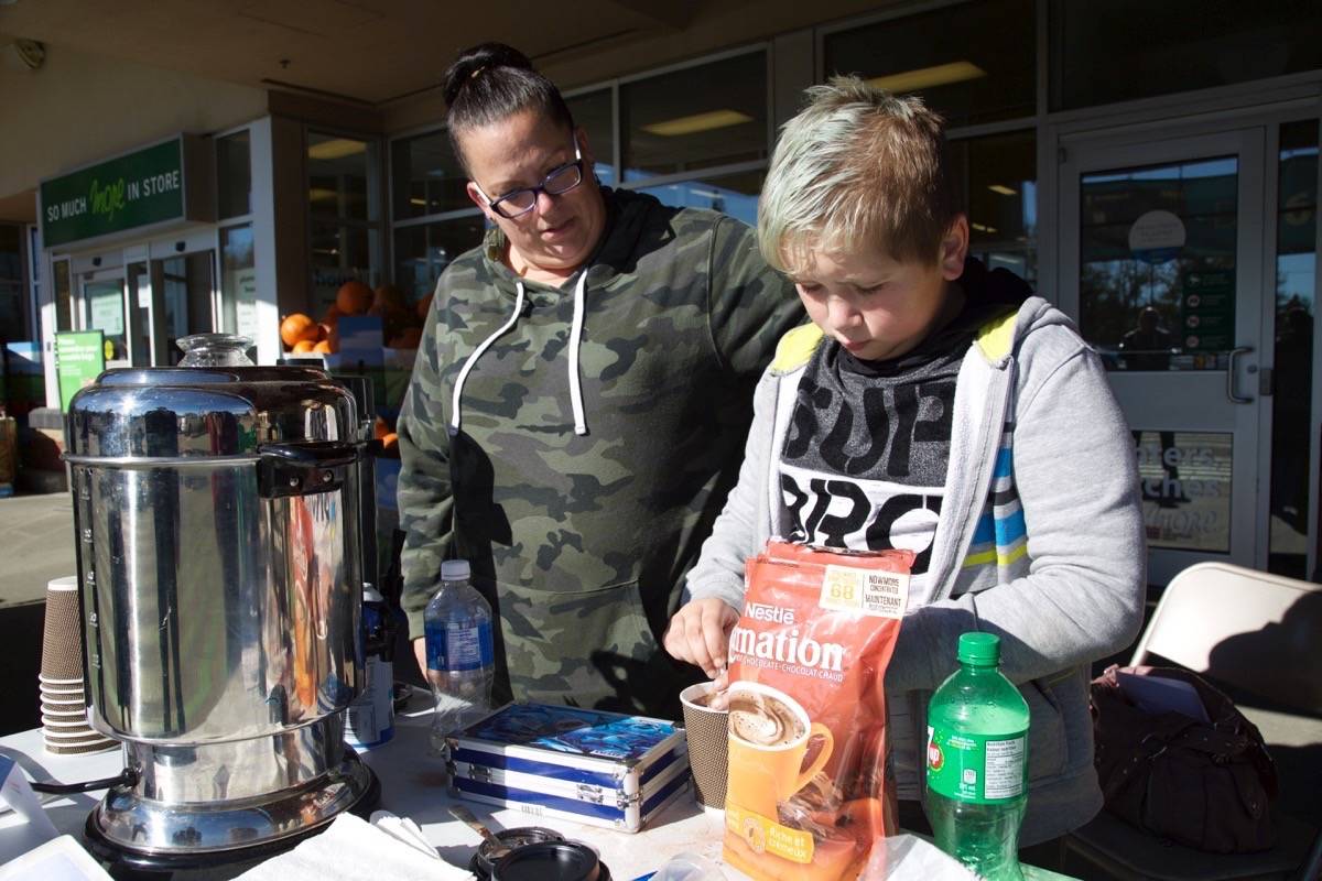 Jayden Sorsdahl, nine, and his mother Melanie were outside Save On Foods at 6720 52nd Ave. on Saturday selling hot chocolate to raise money for STARS. They are hoping to make their fundraising effort, Hot Chocolate for Helicopters, an annual event. Robin Grant/Red Deer Express