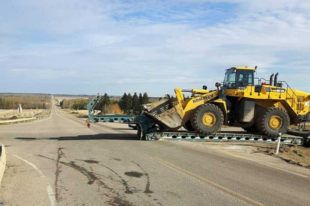 Members of the Ponoka Integrated Traffic Unit dealt with a truck and trailer that became stuck on a guardrail at the Secondary Highway 611 exit at Highway 2. The driver attempted to become unstuck and in the attempt ripped the driveline off the truck.                                Photo courtesy of the Ponoka Integrated Traffic Unit