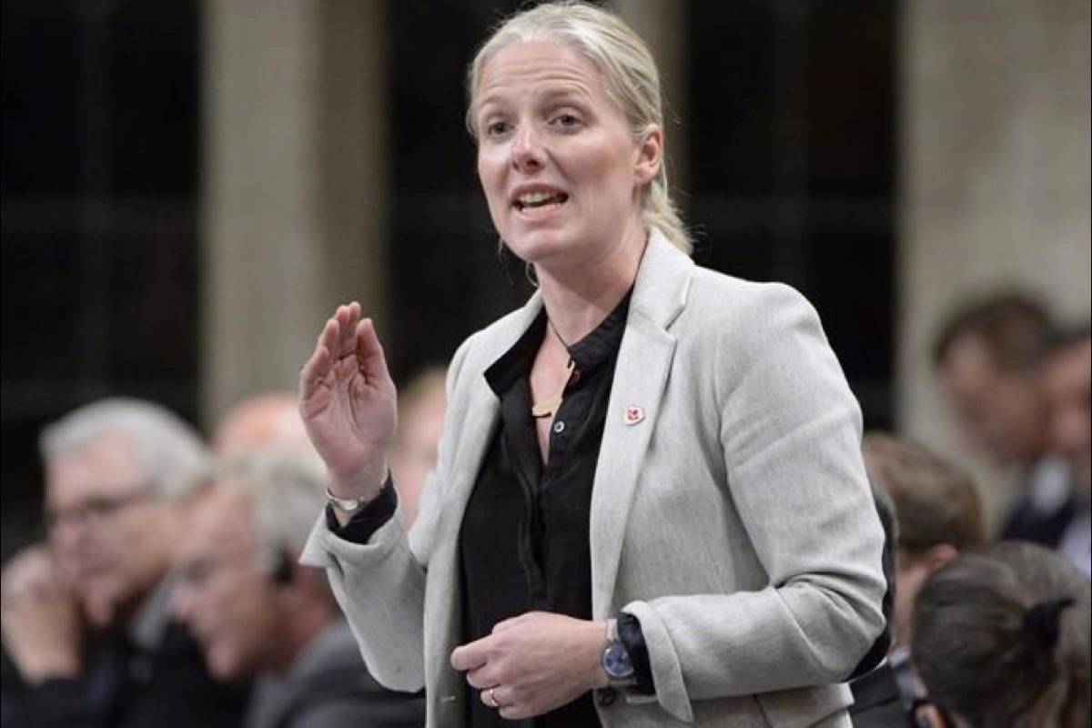 Environment and Climate Change Minister Catherine McKenna rises during question period in the House of Commons on Parliament Hill, in Ottawa on October 4, 2018. The world is going to blow past its most stringent climate goal in less than a quarter century unless the political will erupts to act faster and more directly to curb greenhouse gas emissions. That will be the key message in a new report being released late Sunday by the United Nations Intergovernmental Panel on Climate Change. (Adrian Wyld/The Canadian Press)