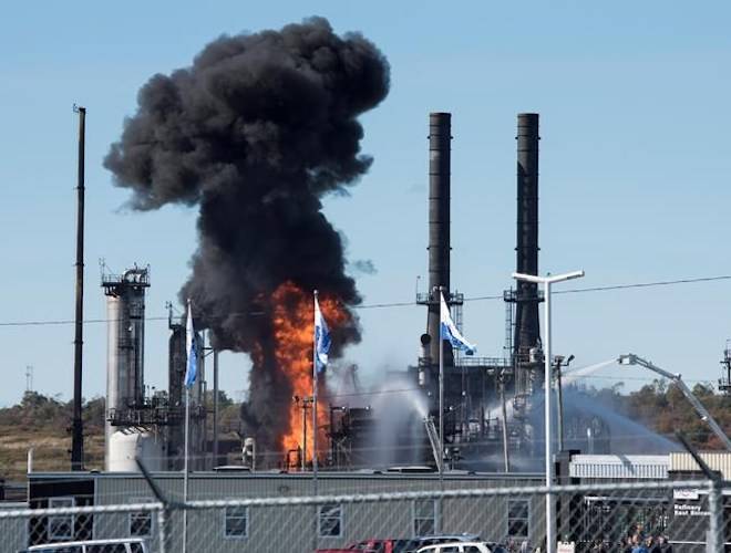 Flame and smoke erupts from the Irving Oil refinery in Saint John, N.B., on Monday, October 8, 2018. THE CANADIAN PRESS/Stephen MacGillivray