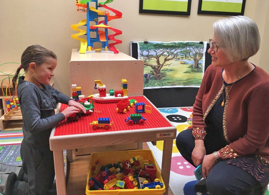 Harlow Raymond, eight, visits with Michelle Sluchinski, executive director of Aspire Special Needs Resource Centre during an open house held Oct. 10th.                                Mark Weber/Red Deer Express