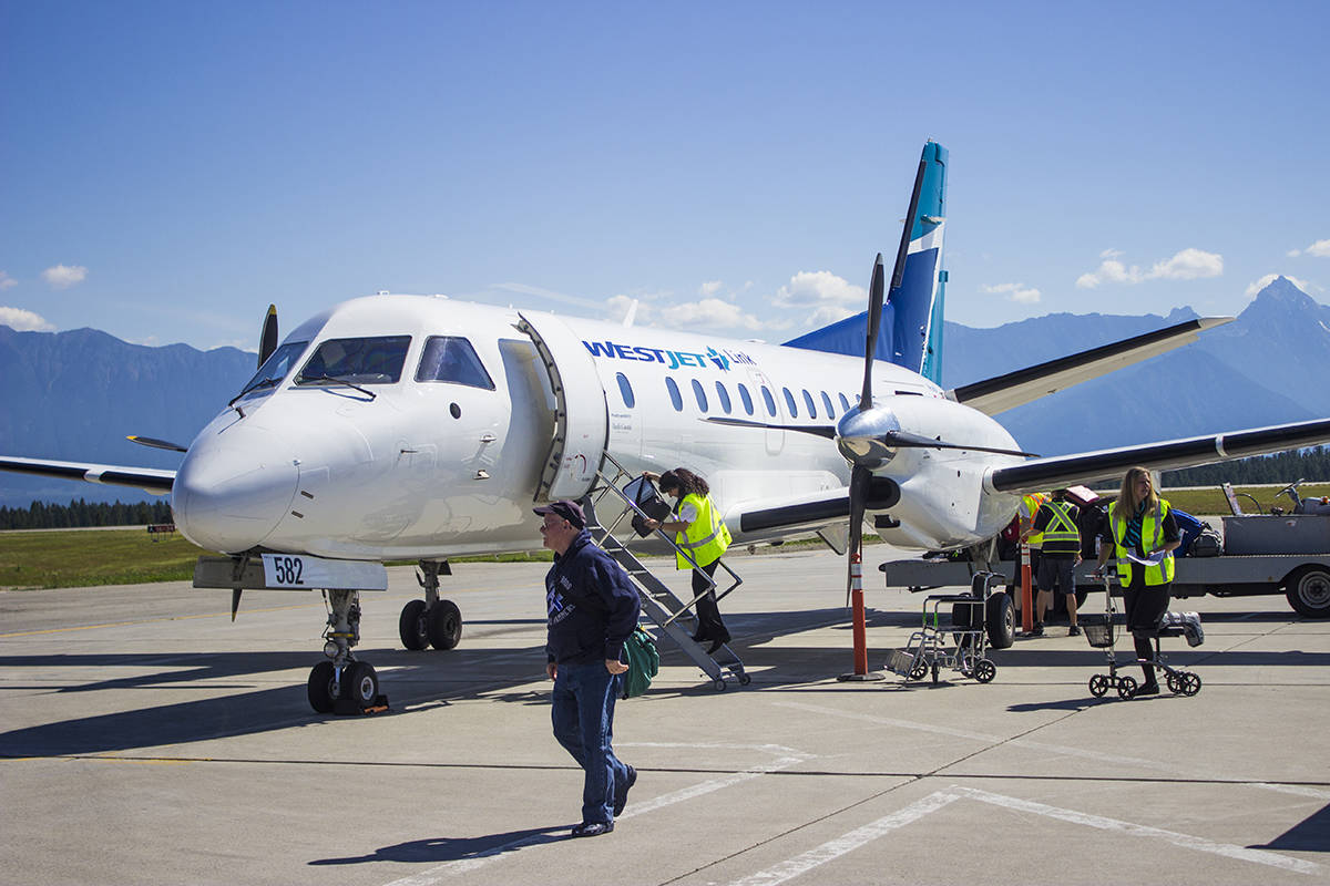 Passengers disembark from WestJet’s first-ever flight into Cranbrook. Paul Rodgers photo.