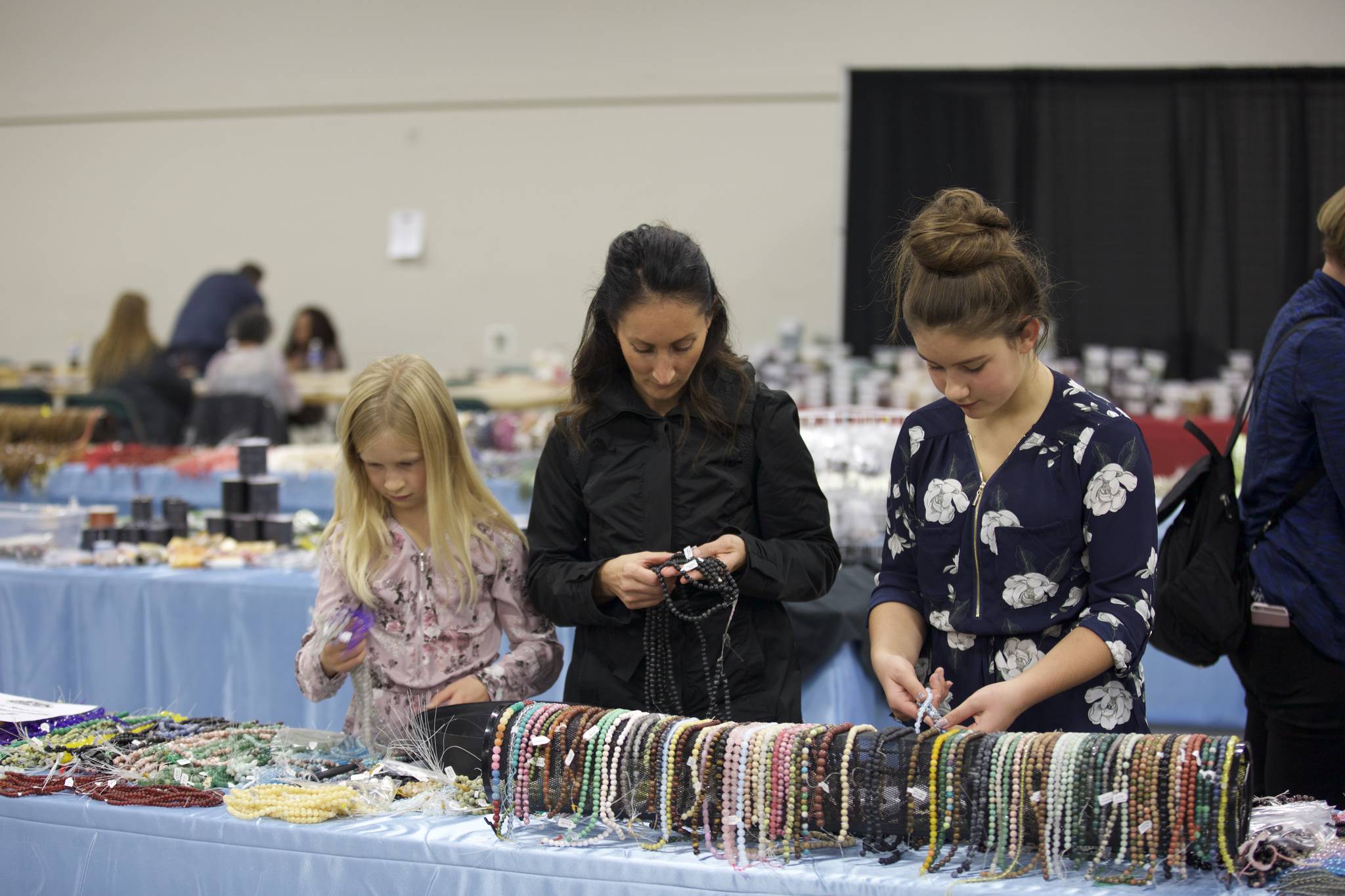 Jayla Prescesky, left, Kristy Prescesky and Lexy Prescesky peruse the rocks and minerals on display at the Rocktober Gem and Mineral Show this past weekend. Robin Grant/Red Deer Express