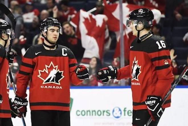 Canada’s Dillon Dube, left, celebrates a goal against Switzerland with Taylor Raddysh (16) during third period quarter-final IIHF World Junior Championships hockey action in Buffalo, N.Y. on Tuesday, January 2, 2018. THE CANADIAN PRESS/Nathan Denette