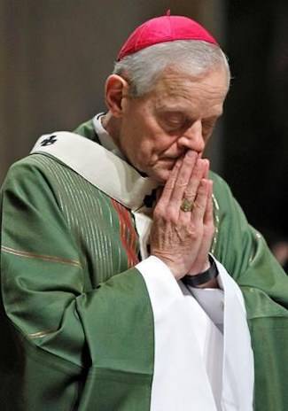 In this Wednesday, Oct. 20, 2010 file photo, Archbishop Donald Wuerl prays as he celebrates Mass at the Cathedral of Saint Matthew the Apostle in Washington. (AP Photo/Alex Brandon, File)