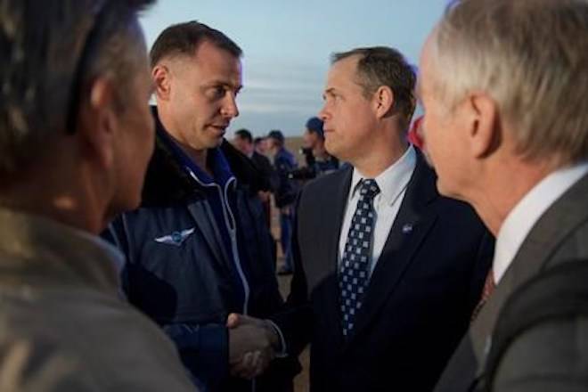 Expedition 57 Flight Engineer Nick Hague of NASA, left, is welcomed by NASA Administrator Jim Bridenstine after Hague landed at the Krayniy Airport with Expedition 57 Flight Engineer Alexey Ovchinin of Roscosmos, Thursday, Oct. 11, 2018, in Baikonur, Kazakhstan, after an emergency landing following the failure of a Russian booster rocket carrying them to the International Space Station. (Bill Ingalls/NASA via AP)