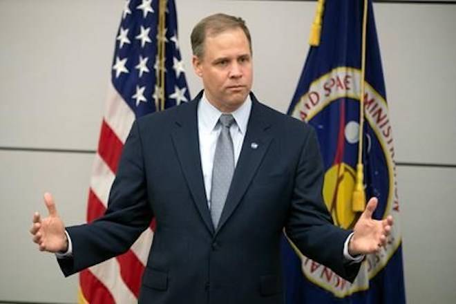 Administrator of the National Aeronautics and Space Administration (NASA) Jim Bridenstine speaks during a news conference at the U.S. embassy in Moscow, Russia, Friday, Oct. 12, 2018. (AP Photo/Pavel Golovkin)