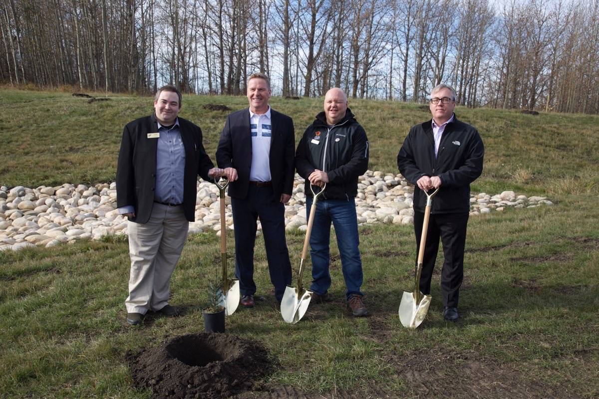 RDC Students’ Association President Chaise Combs, left, RDC President and CEO Joel Ward, Chief Executive Officer with the 2019 Canada Winter Games Scott Robinson and Jim Dixon, director of responsible care with NOVA Chemicals, pose for a photo before planting trees at the unveiling of the NOVA Chemicals Waskasoo Creek Nature Walk. Robin Grant/Red Deer Express