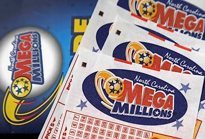 FILE - This July 1, 2016, file photo shows Mega Millions lottery tickets on a counter at a Pilot travel center near Burlington, N.C. (AP Photo/Gerry Broome, File)
