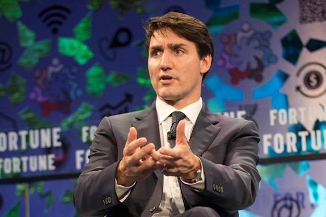 Prime Minister Justin Trudeau speaks at the Fortune Global Forum in Toronto on Monday, October 15, 2018. With just hours to go before pot is legal in Canada, Trudeau says Canadian parents should be talking to their kids about the drug. THE CANADIAN PRESS/Chris Young