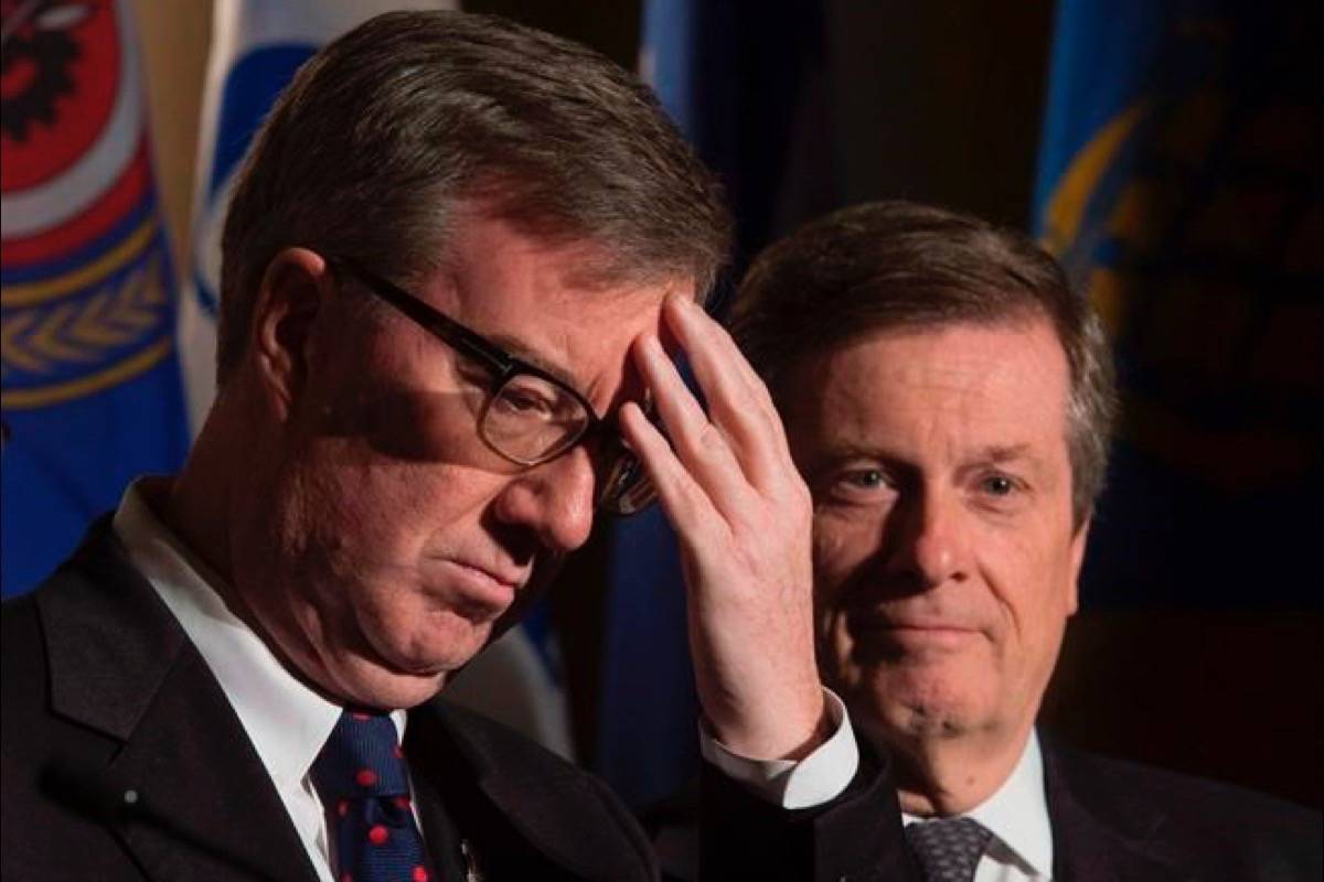 Ottawa Mayor Jim Watson and Toronto Mayor John Tory are seen during a news conference at the Federation of Canadian Municipalities meetings in Ottawa on January 20, 2017. Ottawa Mayor Jim Watson is the target of test legal case that could prompt politicians all across the country to reconsider their use of social media. Three city residents are seeking a court order declaring that Watson infringed their constitutional right to freedom of expression by blocking them from his Twitter feed. (Adrian Wyld/The Canadian Press)
