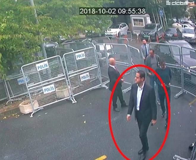 In a still image from surveillance camera footage taken Oct. 2, 2018, and published Thursday, Oct. 18, 2018, by the pro-government Turkish newspaper Sabah, a man previously seen with Saudi Crown Prince Mohammed bin Salman’s entourage during an April trip to the U.S. walks toward the Saudi Consulate in Istanbul just before writer Jamal Khashoggi disappeared there. (Sabah via AP )