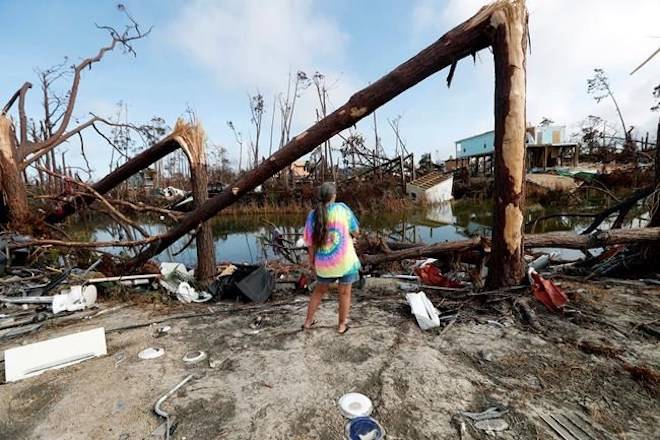 Roxie Cline surveys the damage in the vicinity of her destroyed motor home that she lived in, in the aftermath of Hurricane Michael in Mexico Beach, Fla., Wednesday, Oct. 17, 2018. (AP Photo/Gerald Herbert)