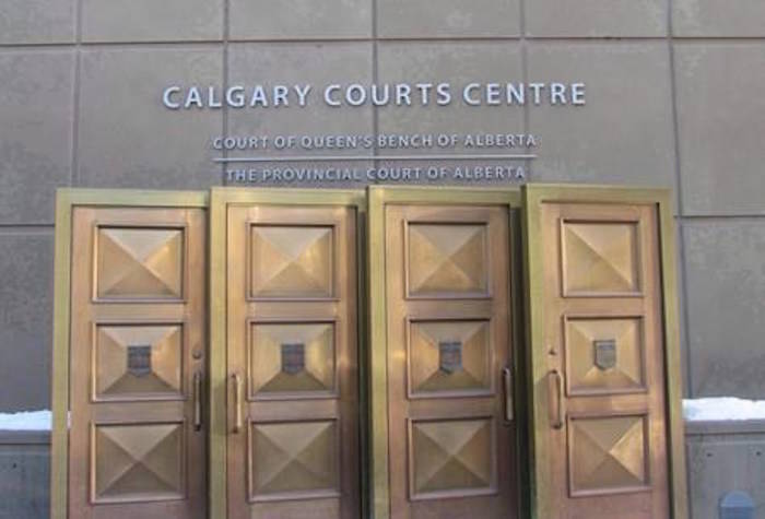 The sign at the Calgary Courts Centre in Calgary is shown on Friday, Jan. 5, 2018. THE CANADIAN PRESS/Bill Graveland
